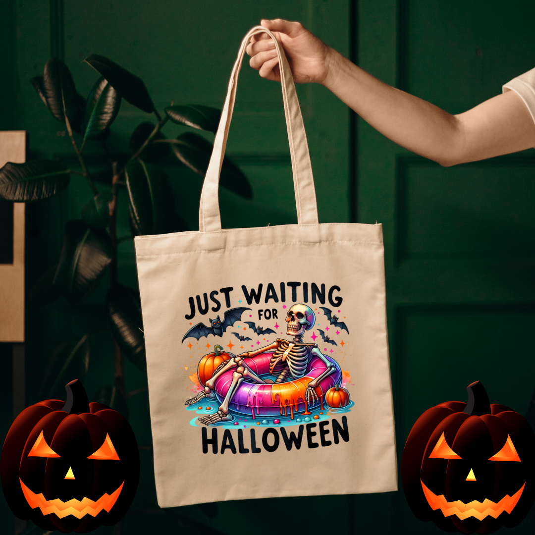 Canvas Halloween tote featuring skeleton in float with pumpkins and bats