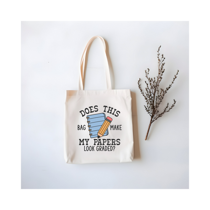 Funny teacher tote bag flat lay with design – notebook & pencil illustration