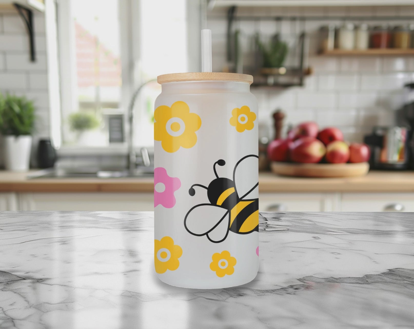 Rotating view of Bee Kind glass can tumbler with bamboo lid and straw