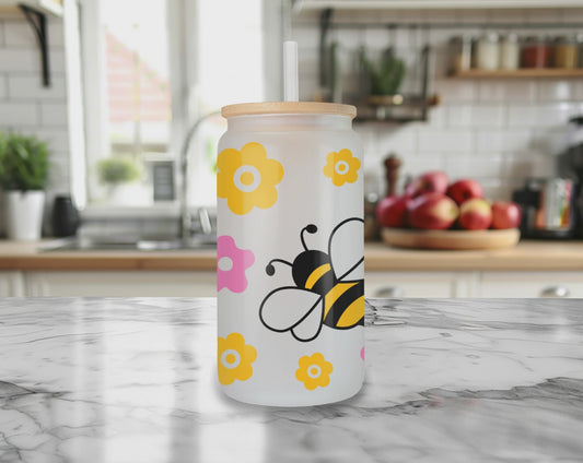 Rotating view of Bee Kind glass can tumbler with bamboo lid and straw